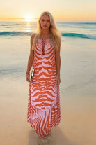 orange and pink floaty sleeveless maxi dress by Lindsey Brown resort wear
