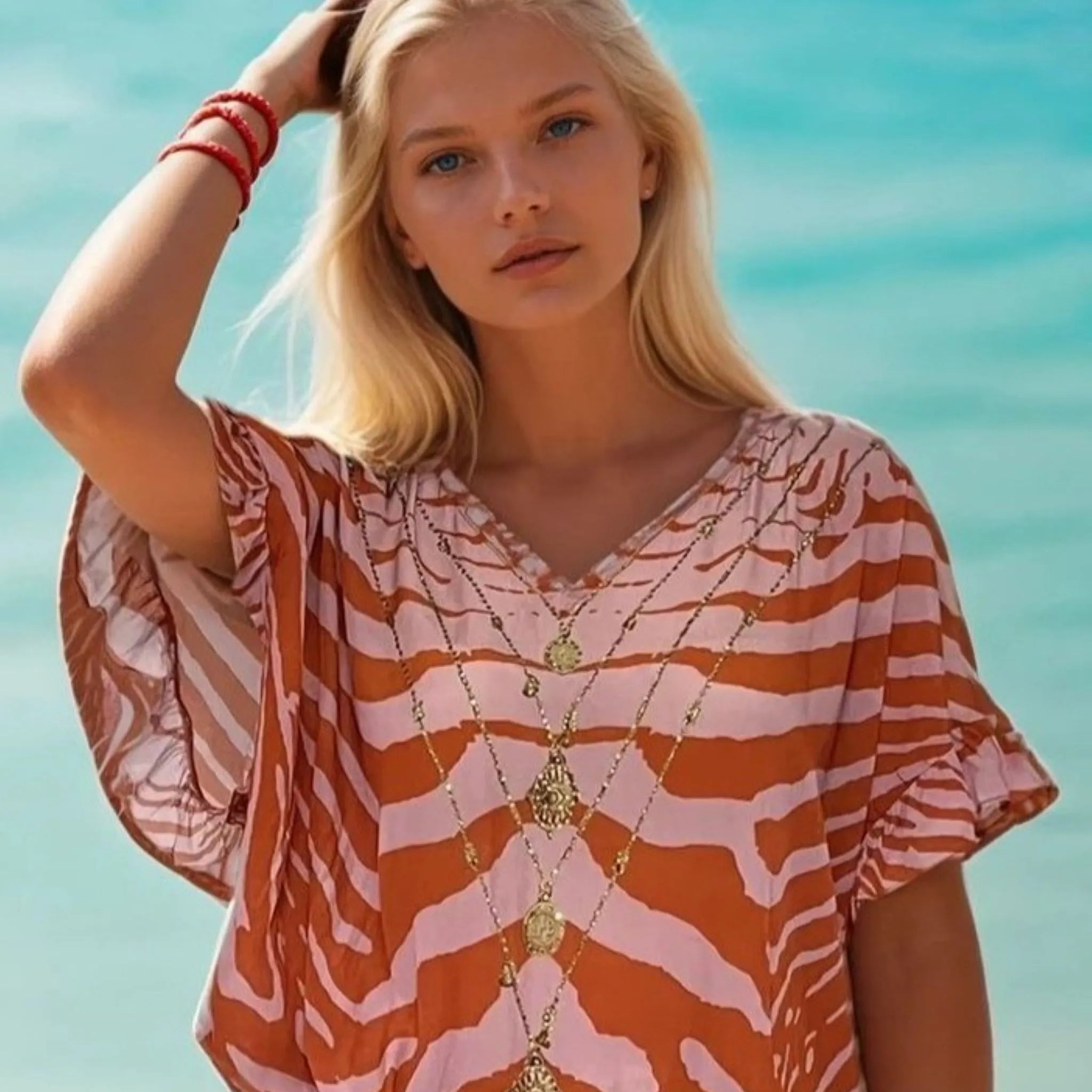 abstract tiger print orange and pink short beach cover up by Lindsey Brown