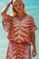 abstract tiger print orange and pink short beach cover up by Lindsey Brown