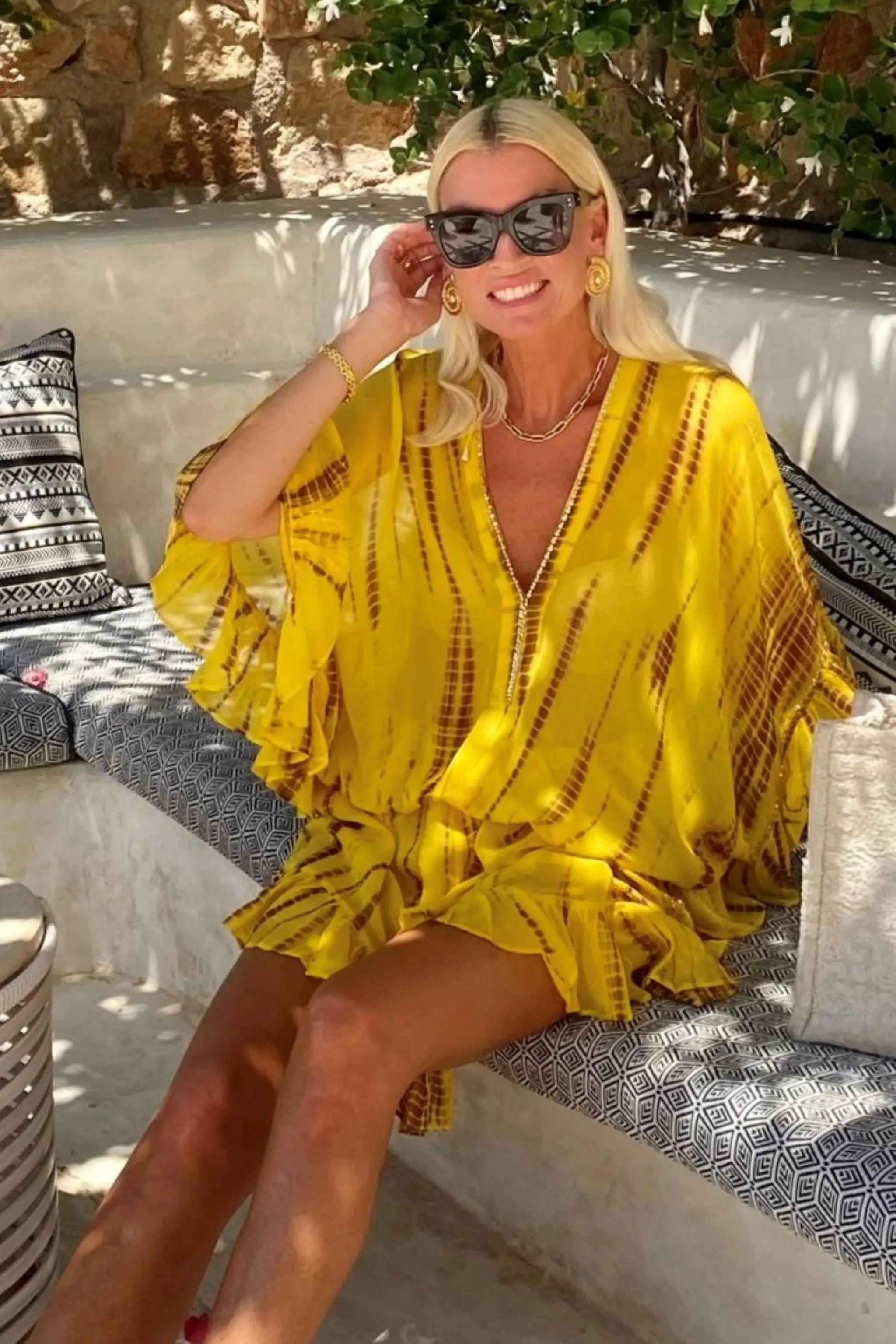 yellow silk resort wear kaftan dress to wear on holiday by Lindsey Brown resort wear