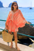 orange silk kaftan dress to wear on warm holidays by Lindsey Brown luxury resort wear 