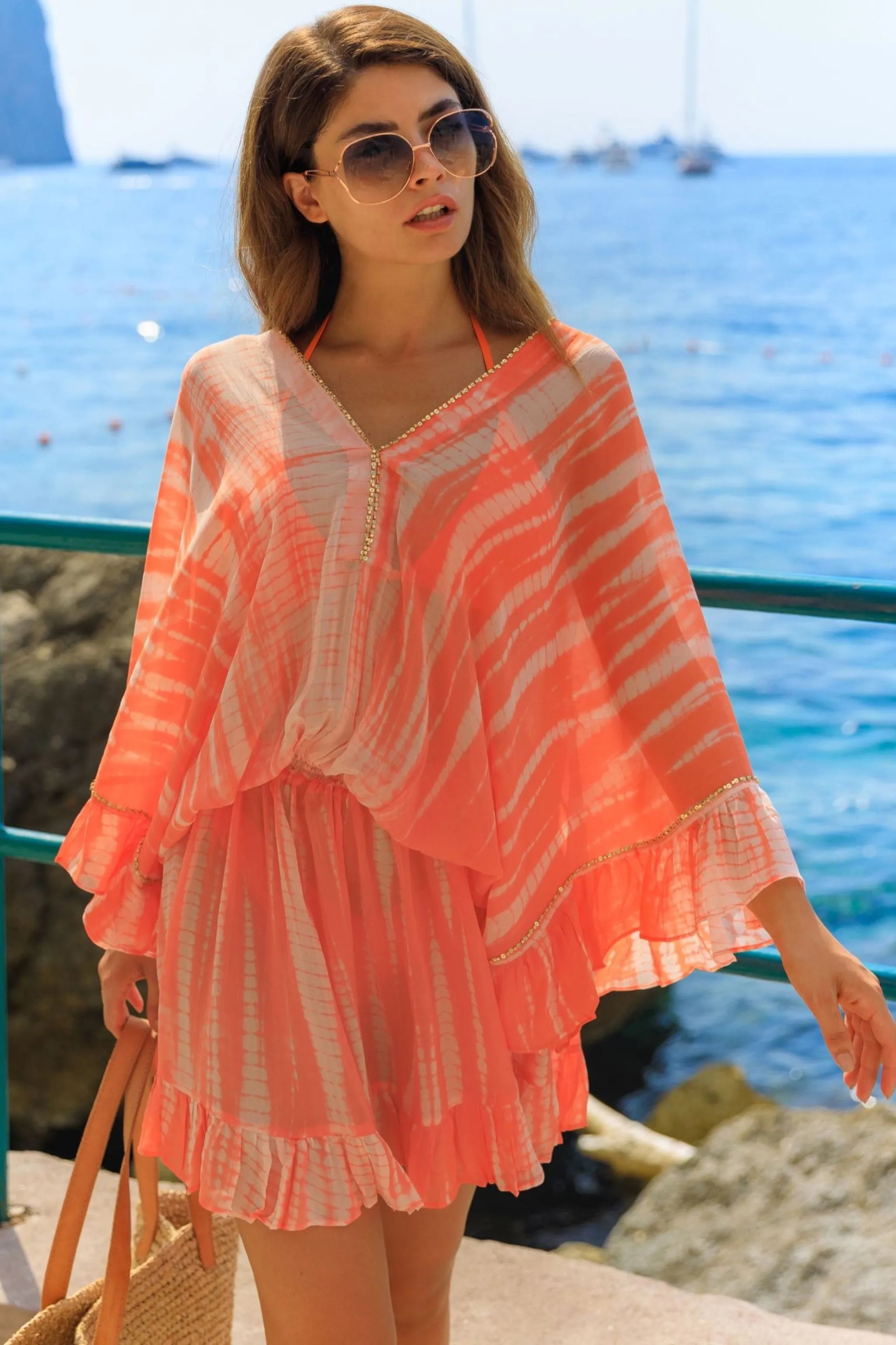 orange hand tie dye silk resort wear kaftans to wear on vacation by Lindsey Brown