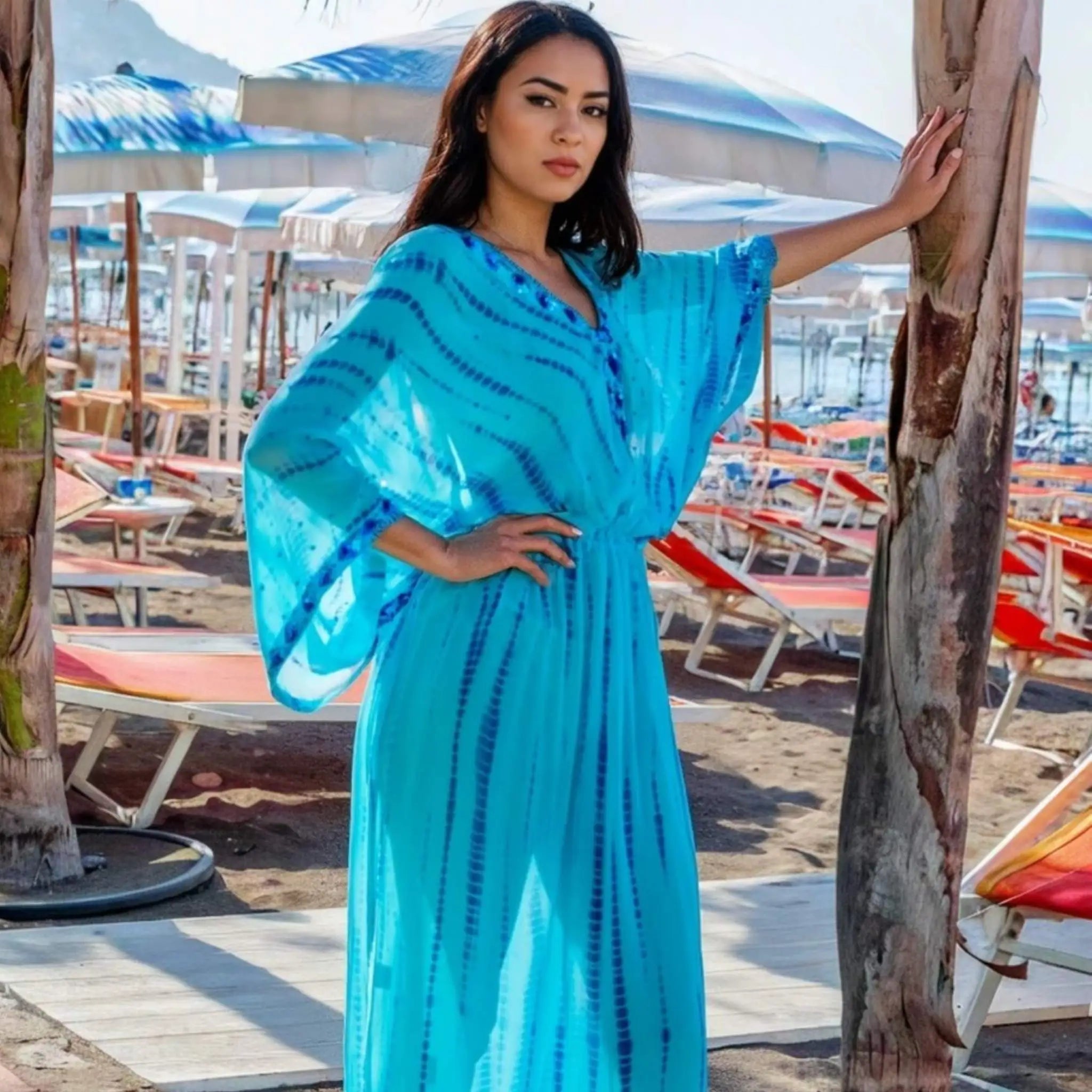 turquoise blue silk maxi kaftans to wear on a luxury vacation by Lindsey Brown