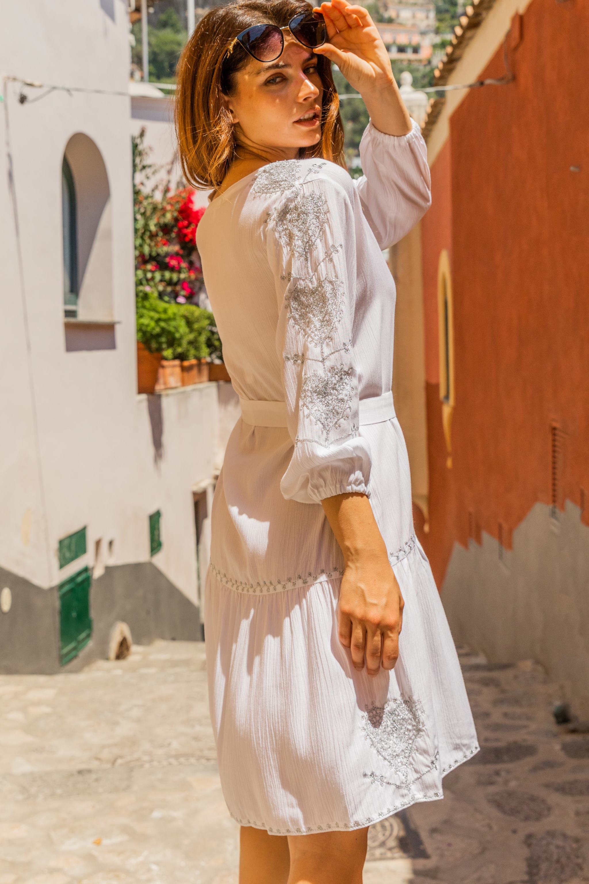 White silver pretty beach dress with silver sleeves motifs by Lindsey Brown resort wear