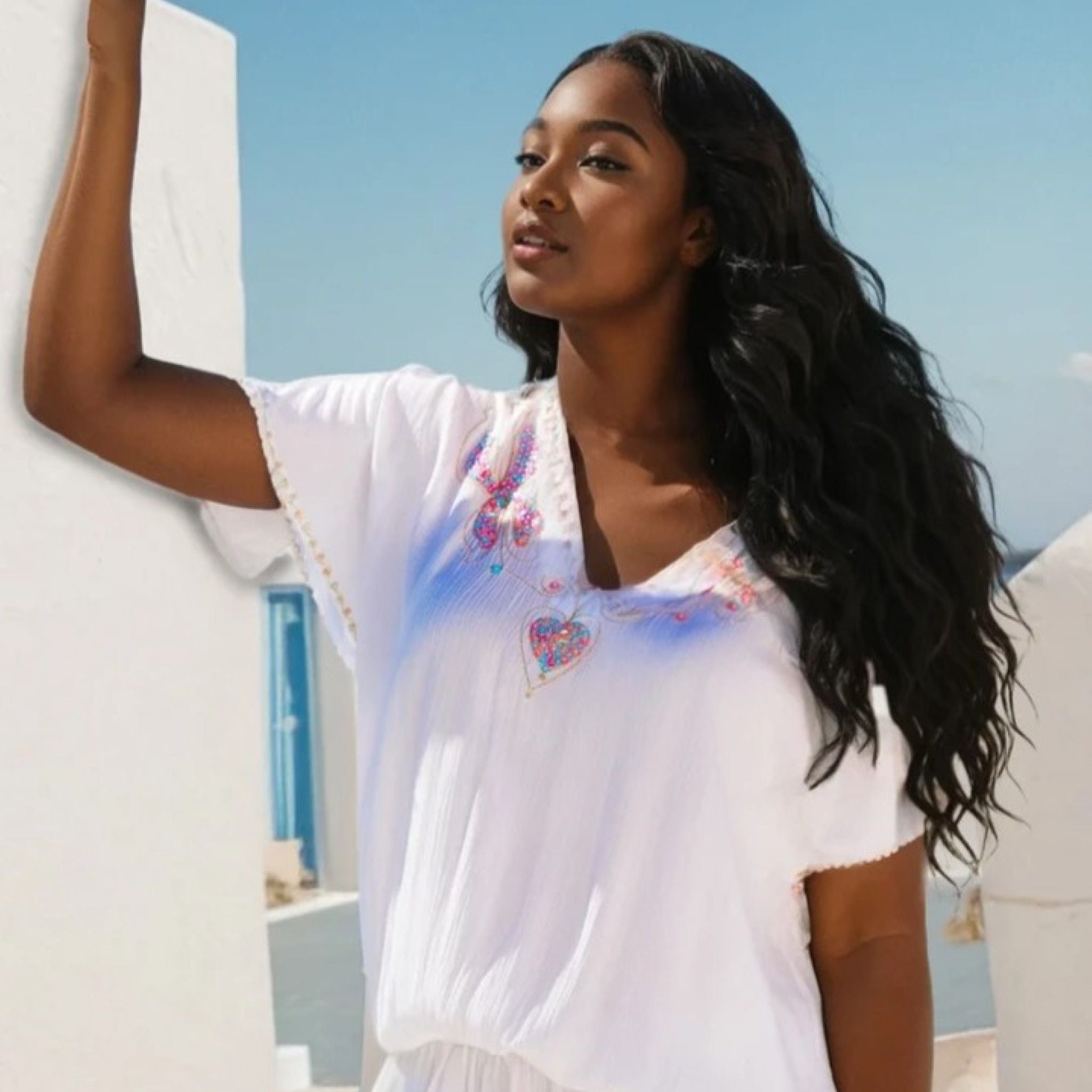 white plus size  cotton short beach dress to wear on holiday by Lindsey Brown luxury resort wear 