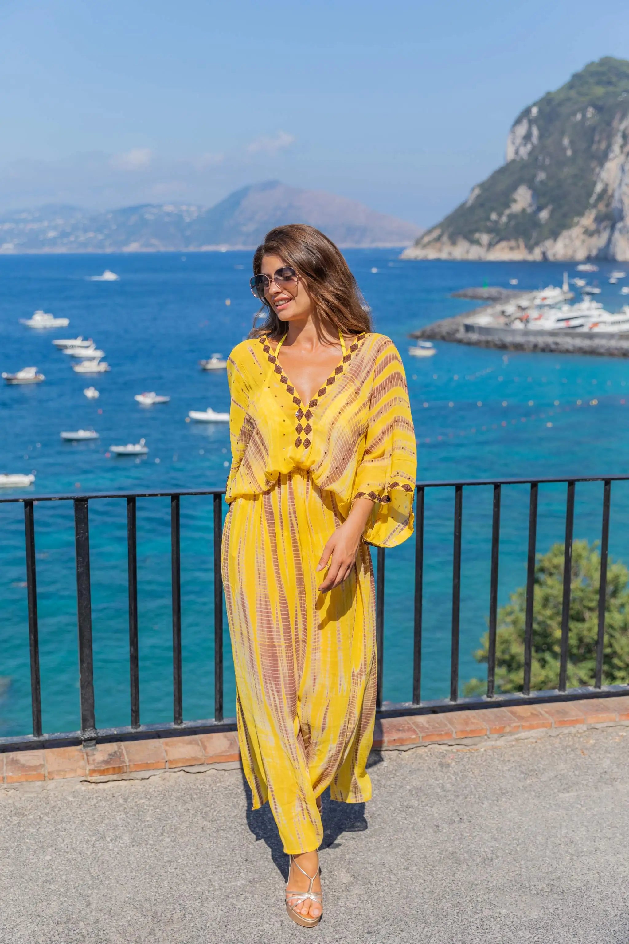 Yellow silk luxury maxi kaftans to wear on holiday by Lindsey Brown resort wear