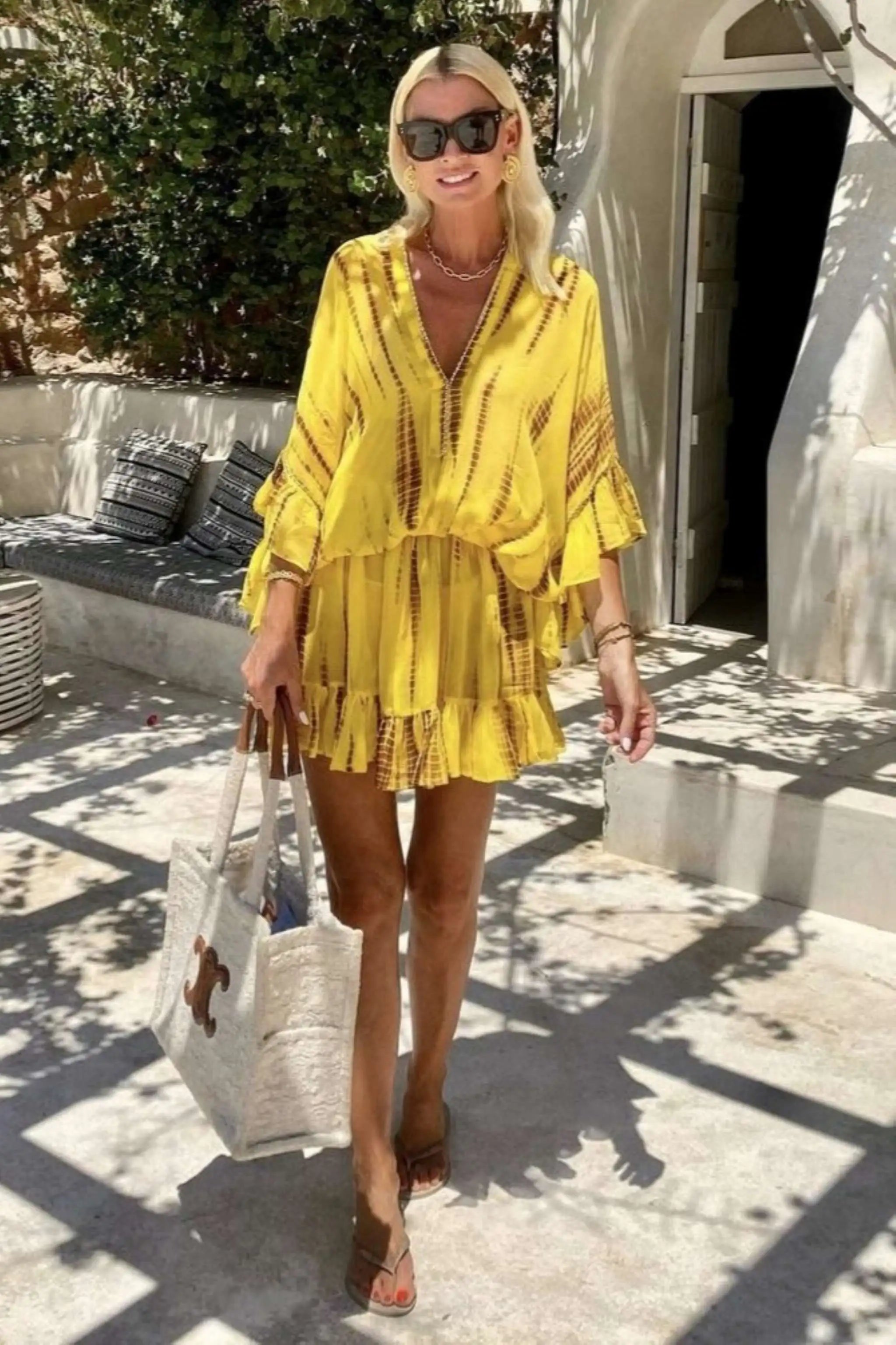 yellow silk bloused kaftan dress to wear on a luxury holiday by Lindsey Brown