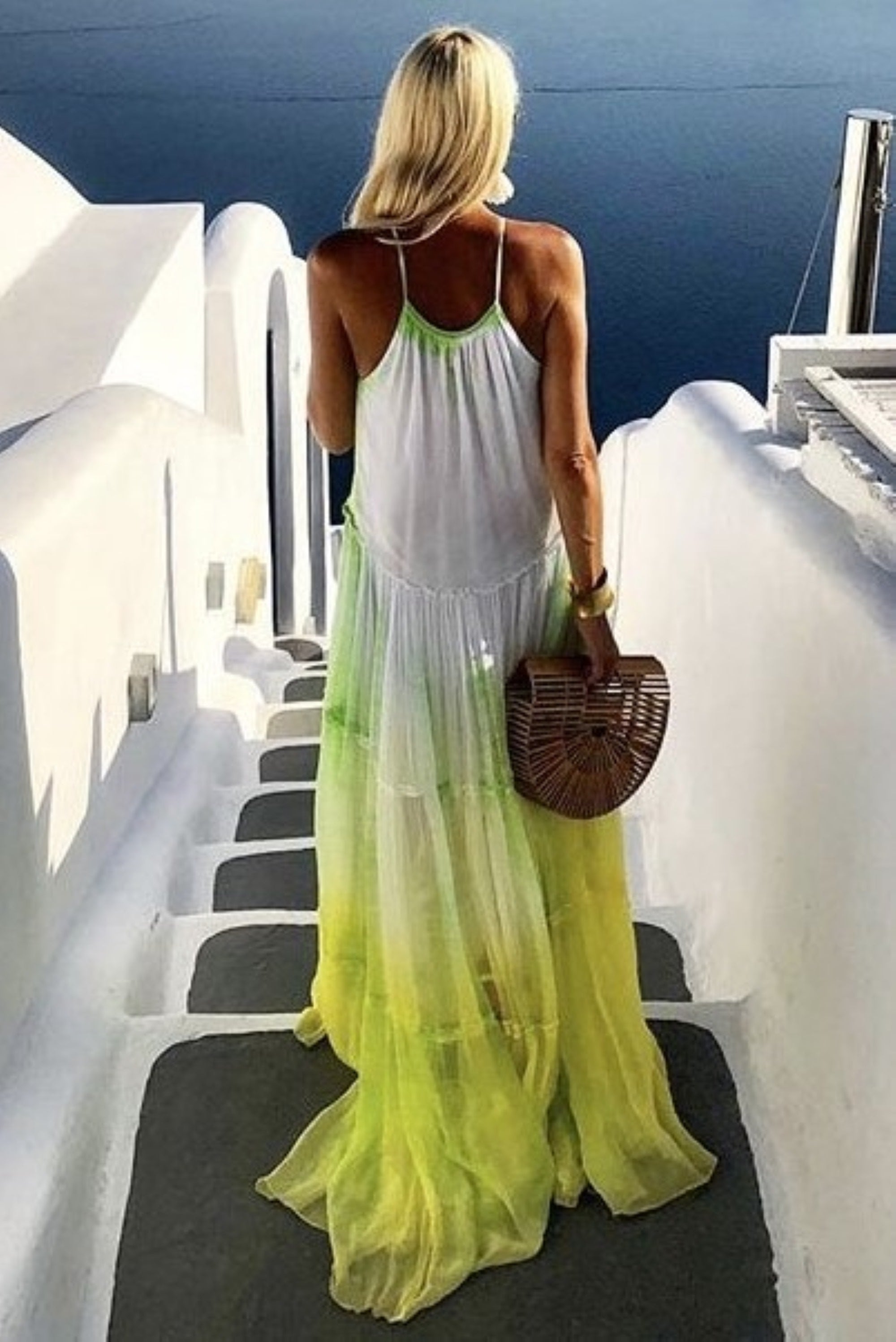 Yellow silk maxi dresses to wear in Santorini by Lindsey Brown resort wear
