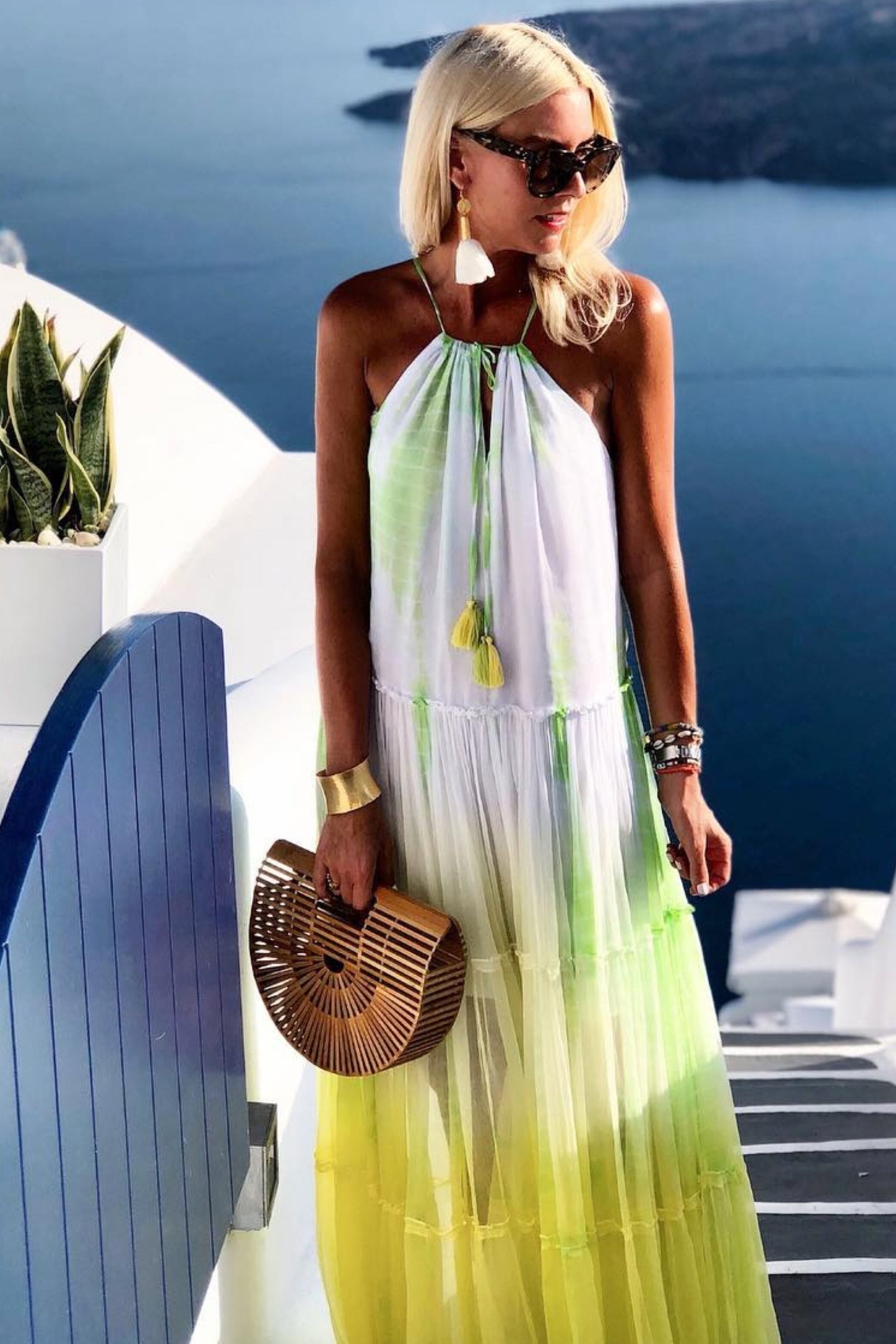 Yellow white silk resort wear dresses to wear in Santorini by Lindsey Brown luxury resort wear